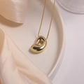 Polished 18K gold plated organic bean pendant necklace with delicate box chain - Letter D (Single Pendant)