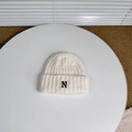 Close-up of white double-layered knit hat featuring black embroidered letter N detail - Approx. 3-8 Years / White