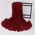 Detail of dark red chiffon shawl with pearl accents and metal tube charms on a rack - 175cm / Burgundy