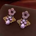 Macro detail of vintage gold earrings with purple zircon crystals and butterfly charms - Gold Purple Crystal Butterfly Earrings (19#)