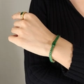 Elegante gouden armband en ring set met smaragdgroen geslepen zirkonia stenen - 15+5cm / Groene Armband