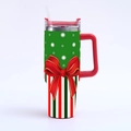 Detail of 40oz stainless steel tumbler featuring festive green patterns and a red bow design - Green and Red Ribbon Bow
