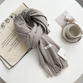 Light grey soft cashmere-feel scarf with tassels and elegant brand tags on white surface - Shrimp Color