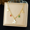 Gold charm necklace with star, butterfly, and gemstone pendants on satin jewelry box - Multi-Pendant Butterfly Style (N3811)