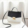 Minimalist black and white contrast crossbody bag with gold metal square lock and handle - Black