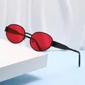 Vintage oval sunglasses with black metal frame and bright red lenses on display - Black Frame Red Lens