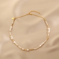 Baroque freshwater pearl necklace with gold metal tubes on elegant satin fabric - Freshwater Pearl Necklace