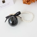Preserved black rose sphere keychain with white pearl strap and black ribbon bow - Black
