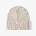 Beige knit beanie for women with pink bow embroidery and ribbed texture finish - Beige