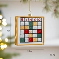 Decorazione natalizia bingo retrò con cornice dorata e quadrati numerati colorati - Cartella della Tombola