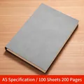 Gray A5 faux leather notebook with 200 pages displayed on a light wooden background - 200 Pages / A5-Off-white