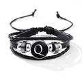 Multilayer black leather bracelet with metal beads and letter Q charm on white background - Letter-Q