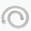 Close-up of a silver Cuban link necklace with sparkling crystals and a detailed clasp - 16in/40cm / Silver