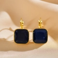 Detailed macro view of French style square earrings with deep blue opal and gold plating - Sapphire Blue