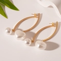 Detail of elegant gold curved earrings with round and heart-shaped faux pearl pendants - Silver Needle White Pearl Heart Round Ball Drop Earrings