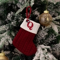 Red knit Christmas stocking with white cuff featuring red embroidered letter Q and small hat - Style Q