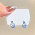 Elegant silver long tassel drop earrings with sparkling cubic zirconia on white card - Twisted Water Drop Rhinestone Style (Cross K-237)
