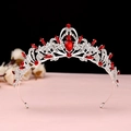 Detail of vintage baroque crown with red crystals and silver metal scrollwork - No.1 Silver (Red Stone)