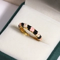 Macro shot of gold floral ring with colorful enamel inlay on velvet jewelry box insert - Black with Pink and White Flower Style (Style 2)