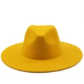 Detail of a bright ginger yellow wool fedora hat with a wide flat brim and structured crown - M (56-58cm) / Yellow