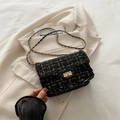 Chic black tweed crossbody bag with gold chain strap and elegant turn-lock closure - Black
