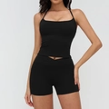 Black yoga set featuring thin strap sports bra and high-waisted cross-waist gym shorts - S / Top And Bottom / Premium Black