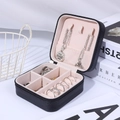 Portable black PU leather jewelry box with pink interior featuring multi-grid storage - Black