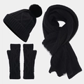 Detailed view of black cable knit winter set including pompom hat, scarf and fingerless gloves - Black