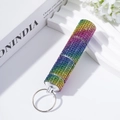 Close-up of rainbow rhinestone pill bottle keychain with three detachable sections - Colorful