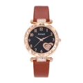 Detail of rose gold starry dial watch with heart motif and rhinestone-encrusted bezel - Brown
