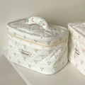 Close-up of quilted cream makeup bag with cherry prints and Melody embroidery handle - Green Cherry Makeup Bag (With Handle)