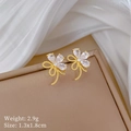 Detail view of gold flower earrings with zircon crystals and size weight labels - Stud Earrings (B532)