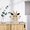 Creative beige wooden cat eyewear holder with leopard glasses on desktop - Goat