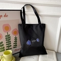 Minimalist black Oxford cloth tote bag featuring blue and white fishbone patterns - Black with Blue Fishbone