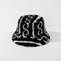 Detail of plush bucket hat featuring soft faux fur texture and black white wavy patterns - M (56-58cm) / Black