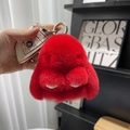 Close-up of a soft red plush bunny keychain with a fluffy texture for bags and car keys - 10cm Bunny / Red