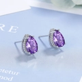 Sparkling pear-cut purple zircon stud earrings in silver minimalist setting - Purple Zirconia