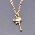 Detail shot of golden stainless steel necklace featuring a polished heart drop pendant - Pendant with Necklace / Gold