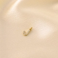 Golden letter J pendant featuring pave-set white zircons on soft satin background - Letter J / Gold