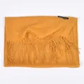 Unisex long cashmere scarf in ginger yellow color featuring classic fringe edges - Turmeric