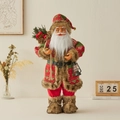 Standing Santa Claus doll in red and green knit outfit holding a berry burlap gift bag - Red Backpack Style / 60CM