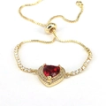 Luxurious adjustable gold bracelet featuring a red heart zircon with micro-pave detailing - Red