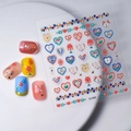 Autocollants ongles Saint-Valentin avec cœurs dorés et motifs floraux colorés - Style Fleur de Coeur (CO-065)