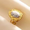 Detailed view of adjustable gold ring featuring an oval white marble stone inlay - Gold-White Turquoise
