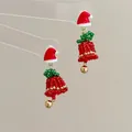 Macro shot of handmade beaded Christmas tree earrings with red bow and gold bell detail - Hat Bell-Silver Pin / Stud Earrings