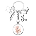 Nurse medical keychain featuring a skull floral glass gem, syringe, and stethoscope charms - Flower Skull