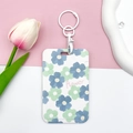 Floral ID card holder with Flower print, blue and green blossoms, and wrist strap - White Handcuff Buckle / Teal