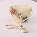 Detail of straw woven flower purse featuring a cotton rope strap and pastel floral accents - Jeweled Flower Style / Cream