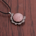 Detail of pink round gemstone pendant with silver moon and star accents and small crystals - Pink Marble/Black Rope