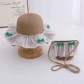 Detail of children's straw hat and matching bag with lace trim and green ribbon bow - Khaki